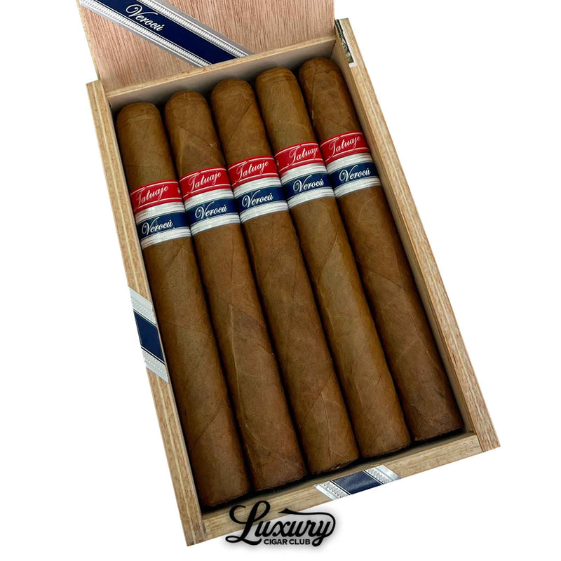 Close-up of a wooden box displaying five Tatuaje Havana VI Verocu Blue No. 1 cigars. Each cigar features a smooth, light brown wrapper and dual bands in red and navy blue labeled "Tatuaje" and "Verocu." The Luxury Cigar Club logo is shown below the cigars.