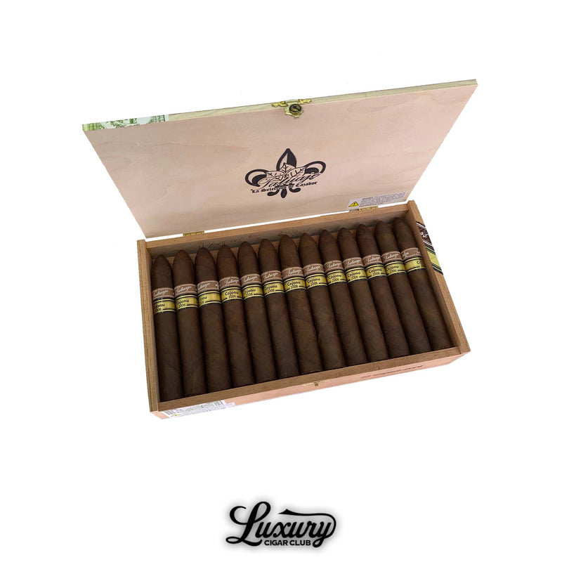 Open box of Tatuaje Miami Cojonu 2006 cigars arranged in two rows with Luxury Cigar Club logo