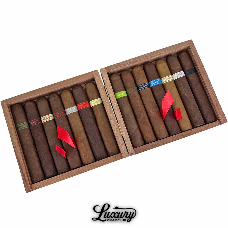 Close-up of the Tatuaje Monster Smash Limited Edition Sampler, showing detailed cigar wrappers with multiple band colors like red, green, silver, and black, each labeled by monster-themed names. Luxury Cigar Club.