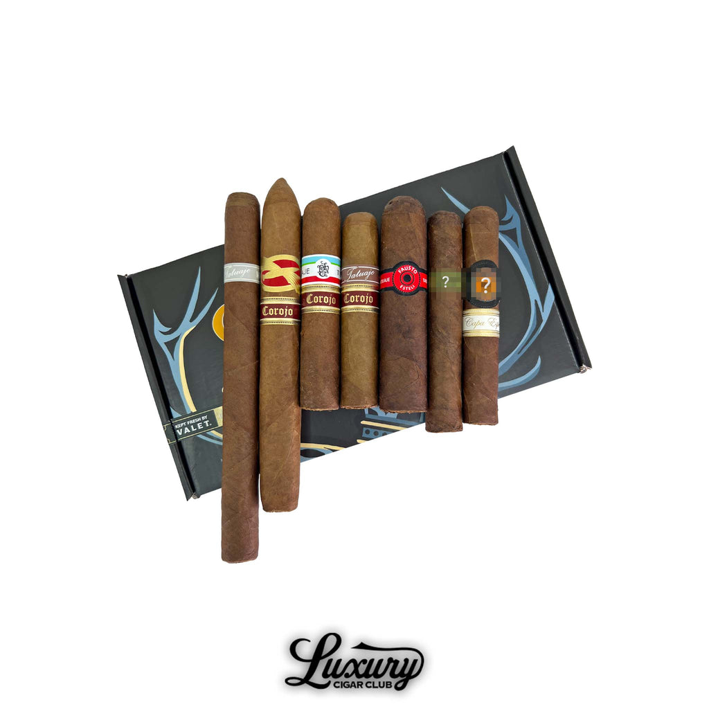 Tatuaje Monsters and Legends cigar sampler displayed on a Luxury Cigar Club box with multiple different Tatuaje blends in assorted vitolas