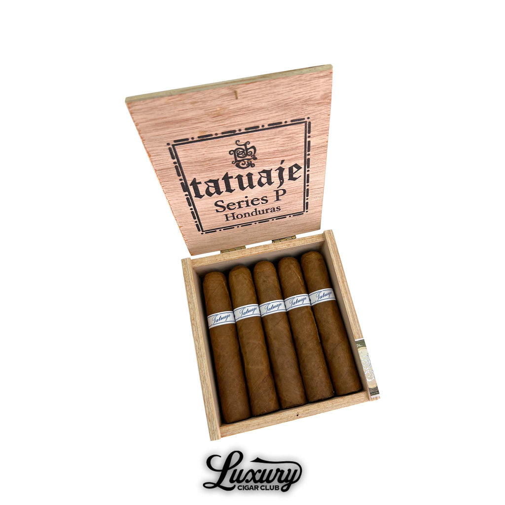 Open box of Tatuaje Series P Honduras Short Robusto cigars natural wrapper cigars arranged neatly in cedar box with lid open on white background Luxury Cigar Club branding