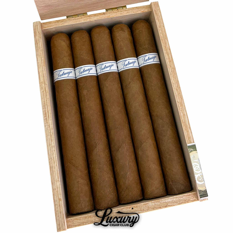 Close up inside wooden box of Tatuaje Series P Honduras Toro cigars, 20 cigars, medium brown wrapper leaf, white and blue Tatuaje bands, Luxury Cigar Club branding under box.