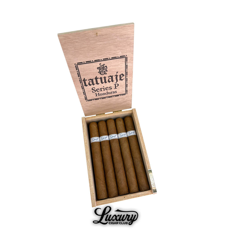 Open wooden box of Tatuaje Series P Honduras Toro cigars, 20 cigars arranged side by side, white and blue Tatuaje bands, Luxury Cigar Club logo beneath.