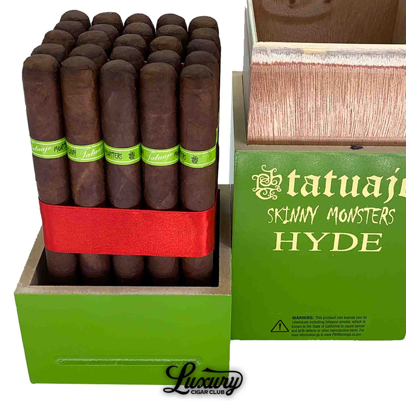 Close-up view of Tatuaje Skinny Monsters Hyde petit lancero cigars showing the rich dark wrapper, bright green Hyde cigar bands, and red ribbon bundle inside the green open box.