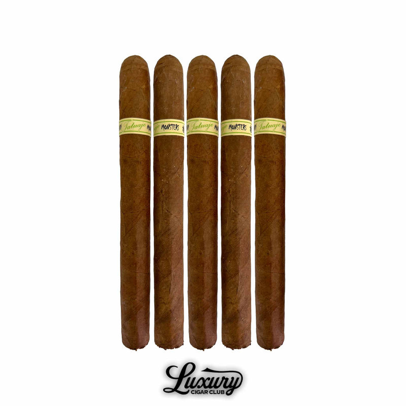Five Tatuaje Skinny Monsters Jekyll petit lancero cigars lined up on a white background with smooth brown wrappers and light green Jekyll bands.