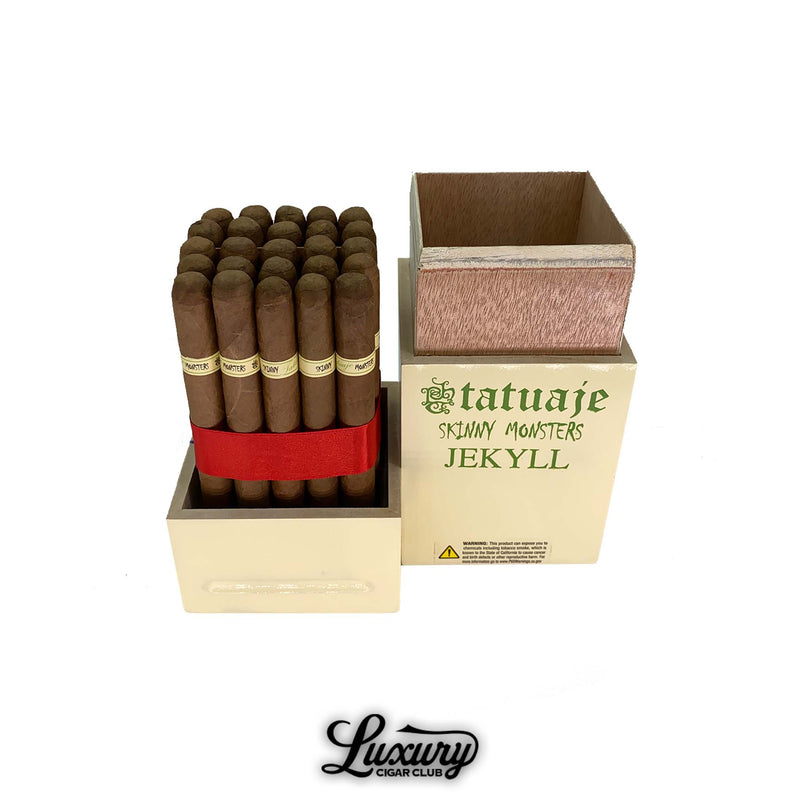 Box of Tatuaje Skinny Monsters Jekyll cigars opened to reveal petit lancero cigars with light green Jekyll bands, neatly bundled with a red ribbon and displayed in a bright green Monster Series box.