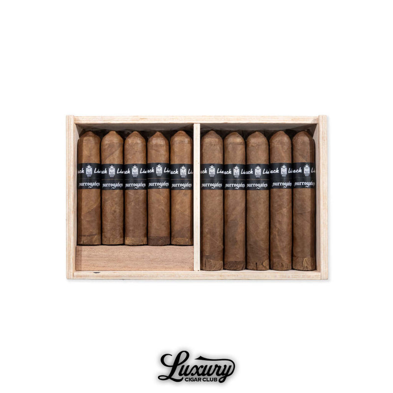 Box of Tatuaje Surrogates Back Line cigars displayed in rows at Luxury Cigar Club for premium cigar enthusiasts.