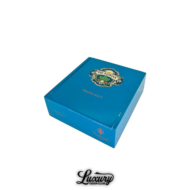 Tradecraft Azorian cigar box closed featuring teal blue packaging with The Azorian crest logo and Tradecraft branding Luxury Cigar Club