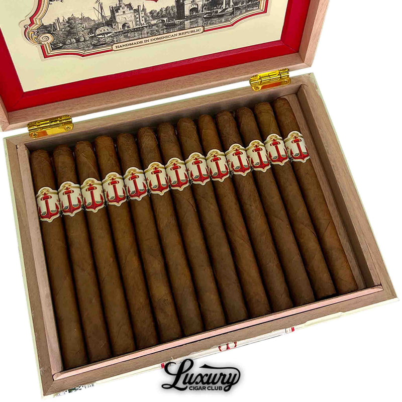 Close-up of United Cigars Red Anchor Gunner cigars inside an elegant wooden box, showcasing detailed craftsmanship, featured by Luxury Cigar Club.