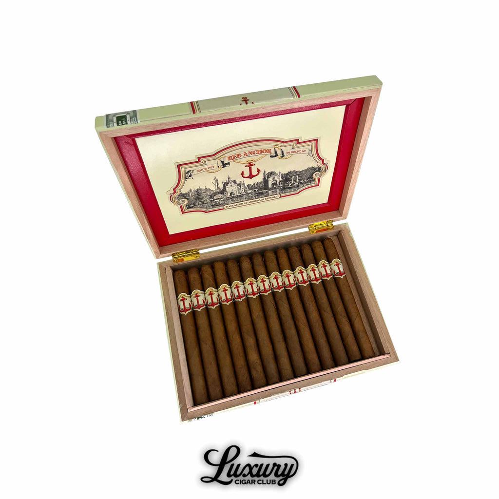 United Cigars Red Anchor Gunner box of premium cigars displayed open with red and gold nautical-themed bands, presented by Luxury Cigar Club.