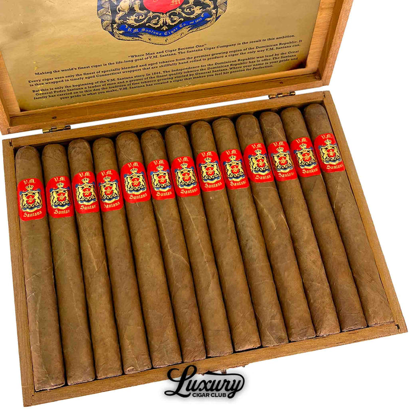 Luxury Cigar Club product photo showing a close up of VM Santana Corona Connecticut USA Aged 29 Years cigars neatly lined inside the open wooden box displaying red and gold cigar bands.