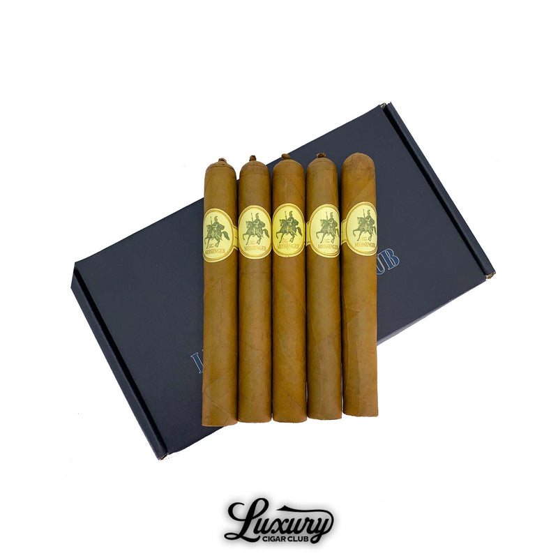 Five Valacari The Messenger cigars with golden Connecticut wrappers and gold horse-and-rider bands displayed on a black Luxury Cigar Club box. Luxury Cigar Club logo below.
