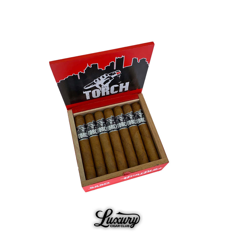 Open red and black box of Veritas Torch Connecticut Robusto cigars, featuring golden Connecticut shade wrappers with bold black bands displaying the Torch logo and city skyline design. Luxury Cigar Club logo below.