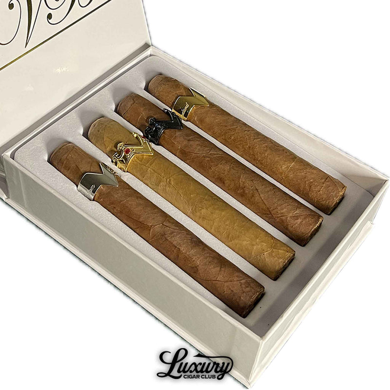 Close-up of Vicente Blends 4 Course Aficionado Experience cigars with signature V-shaped metal bands in an elegant box from Luxury Cigar Club.