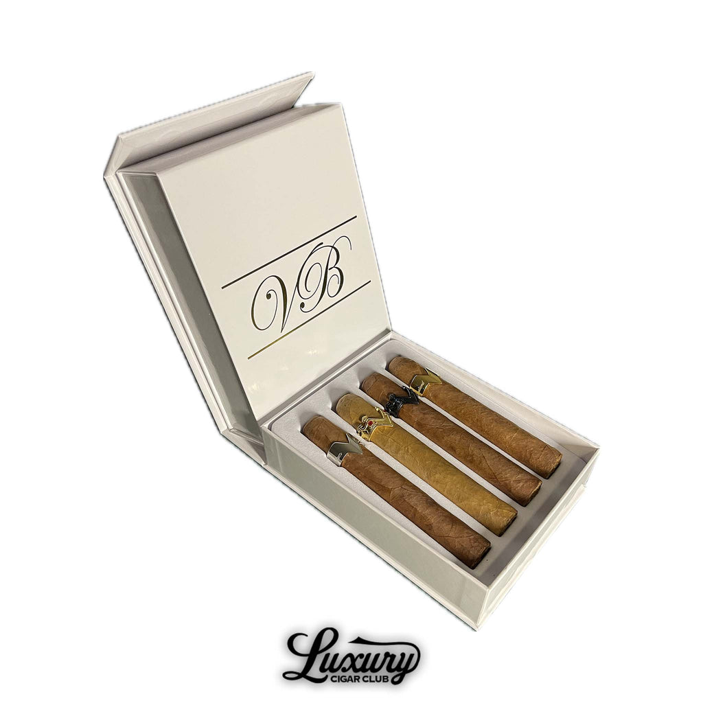 Vicente Blends 4 Course Aficionado Experience cigar sampler displayed in a white box with gold VB logo, presented by Luxury Cigar Club.