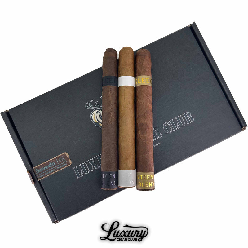 Close-up of Vicente Blends Sleek cigar sampler showcasing detailed foot bands and wrapper shades, presented by Luxury Cigar Club.