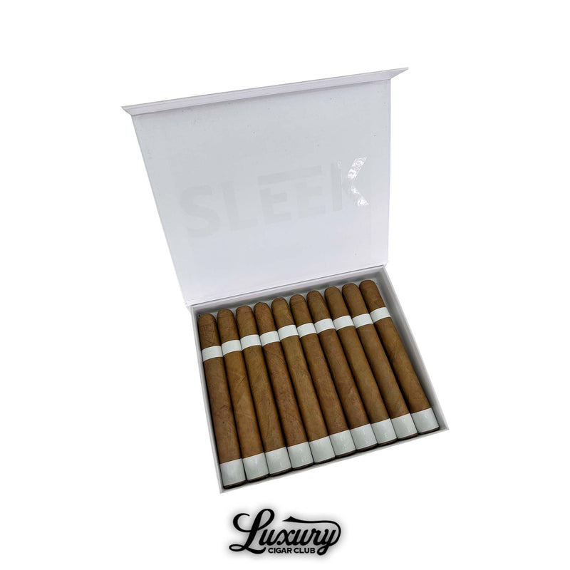 Open box of Vicente Blends Sleek White Churchill cigars featuring light brown wrappers and minimalist white bands. The lid displays the word “SLEEK” in faint white letters. Luxury Cigar Club logo below.