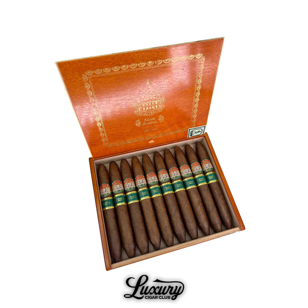 Villa Casdagli Edición Limitada Salomone cigars arranged in an open cedar box with rich brown wrappers and elegant green and gold bands, featuring embossed branding, presented by Luxury Cigar Club.