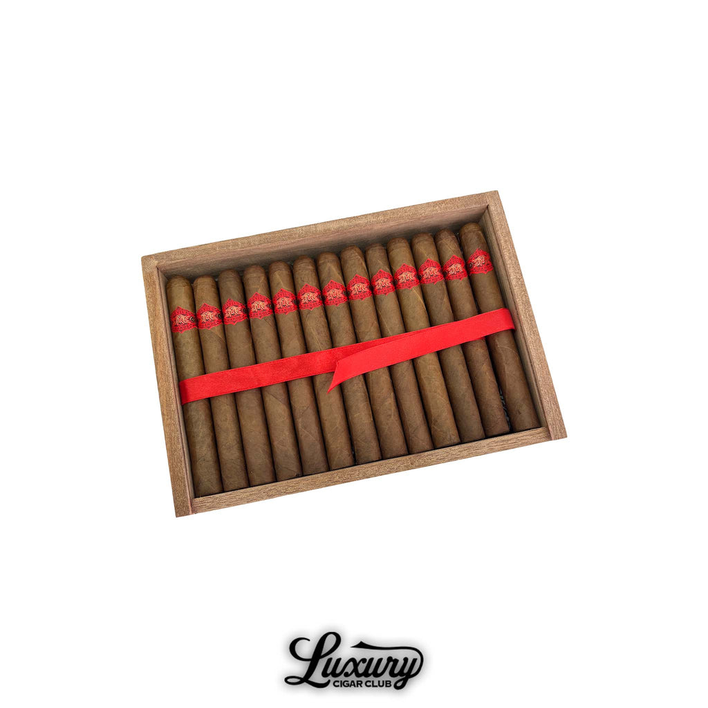 Open cedar tray of Warped Devil’s Hands Lonsdale cigars with red bands arranged in two rows, presented in wooden box from Luxury Cigar Club.