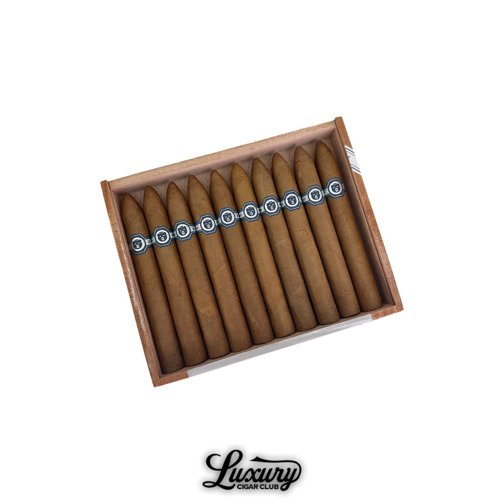 Box of Warped El Oso Blanco Limited Edition 2025 Belicoso cigars displayed in an open cedar box with black and silver bands, available at Luxury Cigar Club