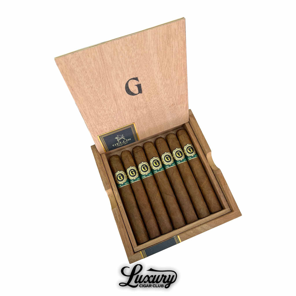 Open box of Warped Gellis Family Absolutos Corona Gorda cigars with green and gold bands, premium handcrafted cigars from Luxury Cigar Club