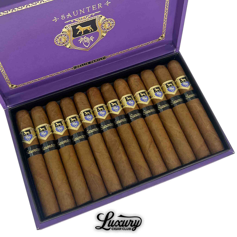 Close-up of Warped Saunter cigars from Gellis Family Cigars, neatly arranged in a purple and gold-trimmed box with black and gold bands, displaying the “Luxury Cigar Club” branding at the bottom.