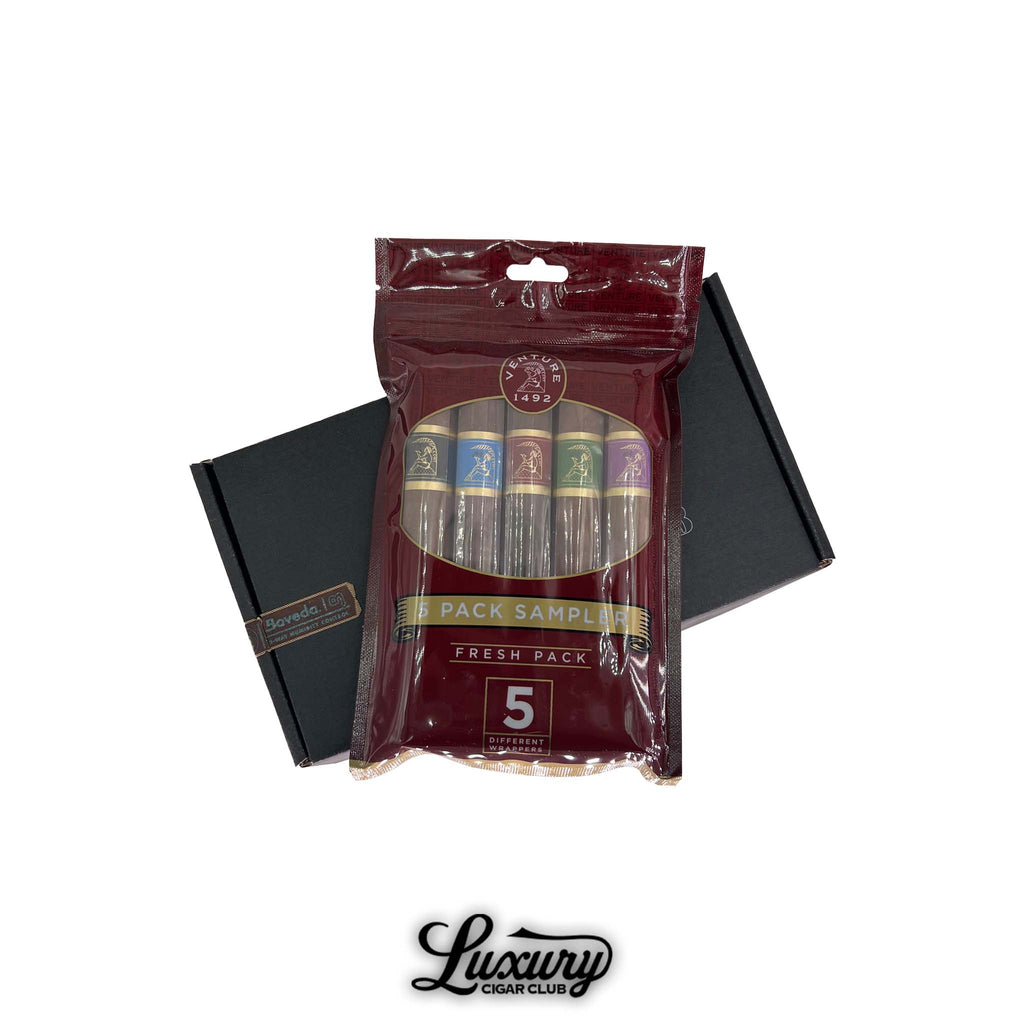 Fuente y Padrón Legends Limited Edition cigar sampler box open to reveal two sets of premium cigars with commemorative artwork, displayed by Luxury Cigar Club.