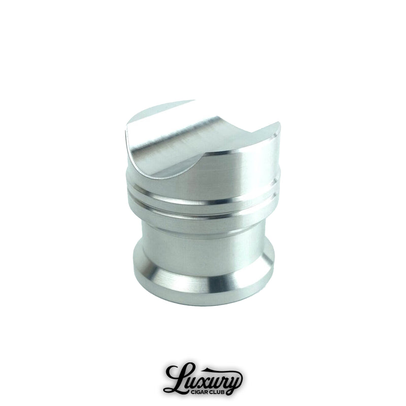 Polished raw silver Zimmer Maverick cigar rest shown upright, minimalist cigar accessory available from Luxury Cigar Club.