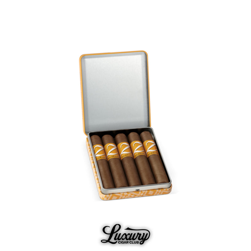Metal tin containing Zino Nicaragua Half Corona cigars with bold yellow bands, offered online by Luxury Cigar Club.