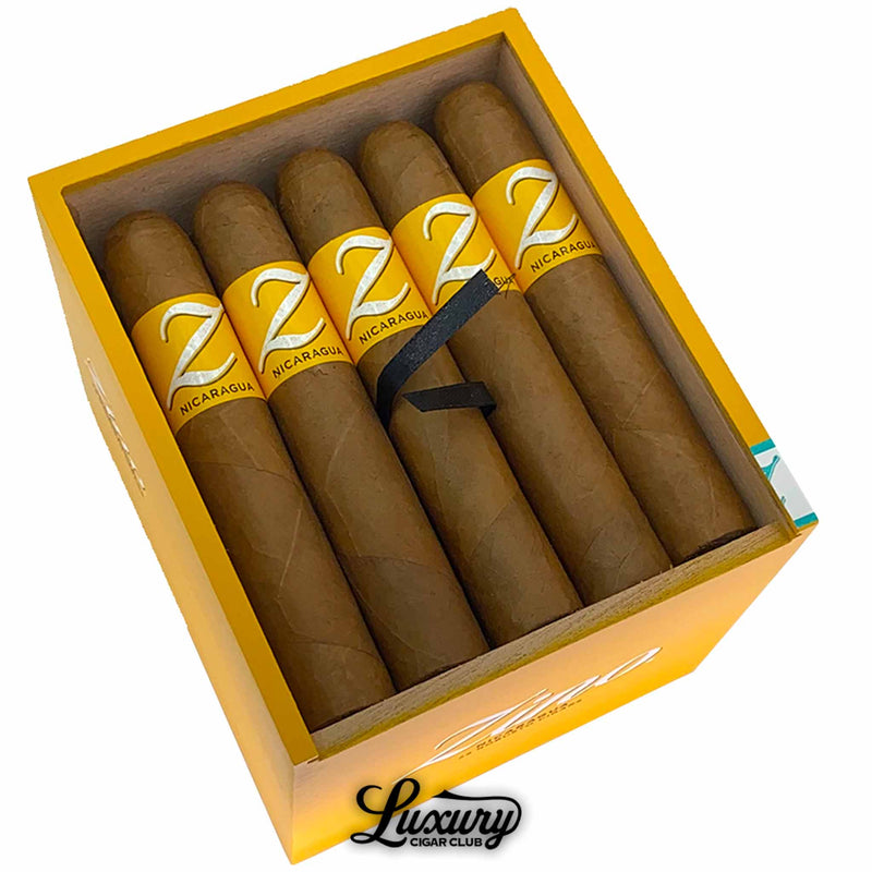 Close-up view of Zino Nicaragua Robusto cigars with smooth wrappers and yellow branding, available at Luxury Cigar Club.