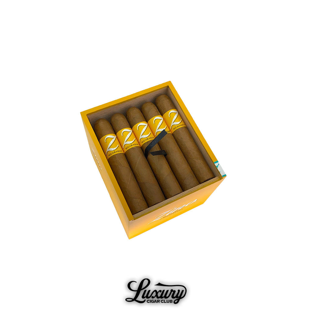 Box of Zino Nicaragua Robusto cigars neatly arranged with yellow bands, presented for online purchase from Luxury Cigar Club.