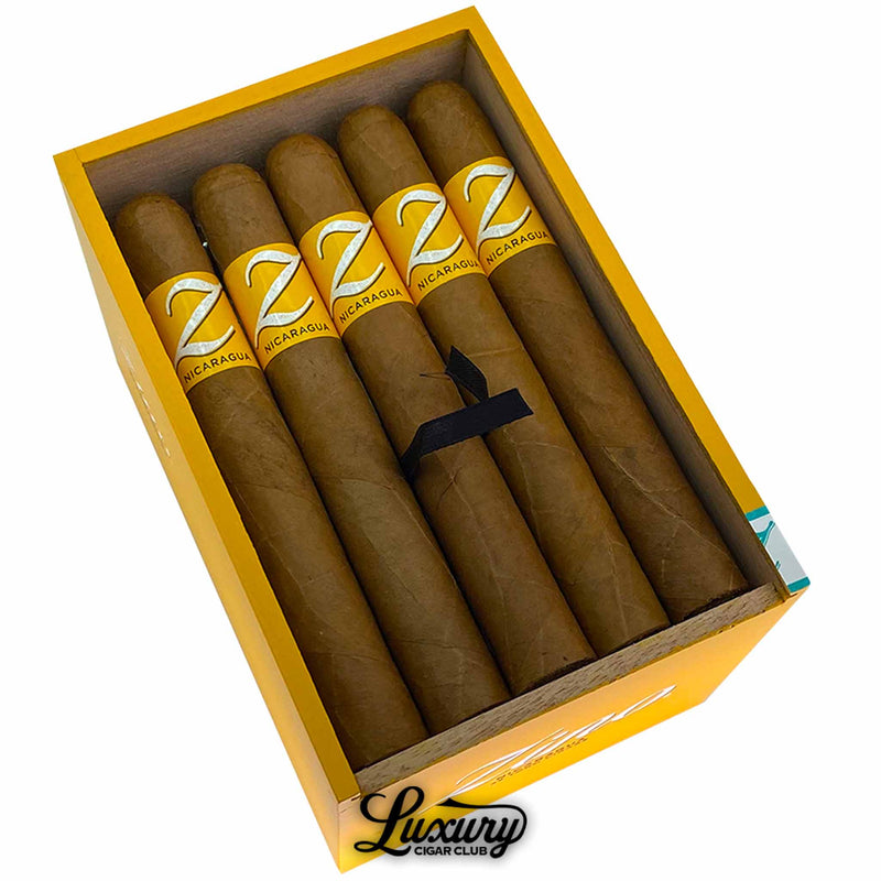 Detailed view of Zino Nicaragua Toro cigars, highlighting rich tobacco leaves and yellow branding at Luxury Cigar Club.